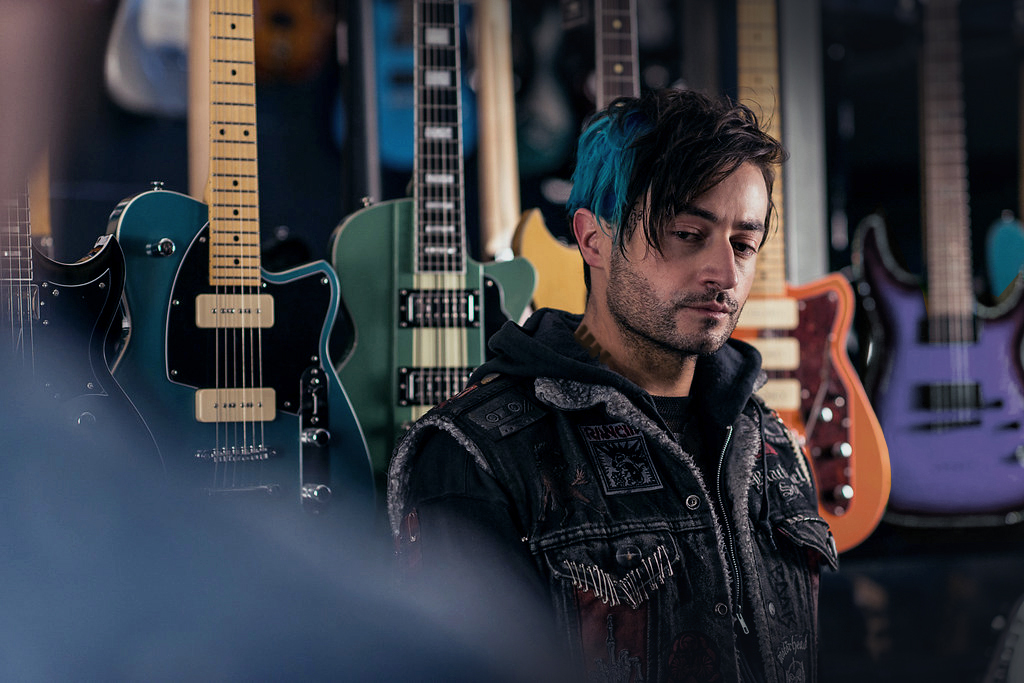ClicK still — Mark Diaco in the guitar shop