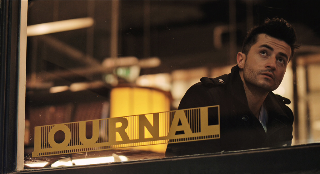 Halfway still — Mark Diaco at the Journal window