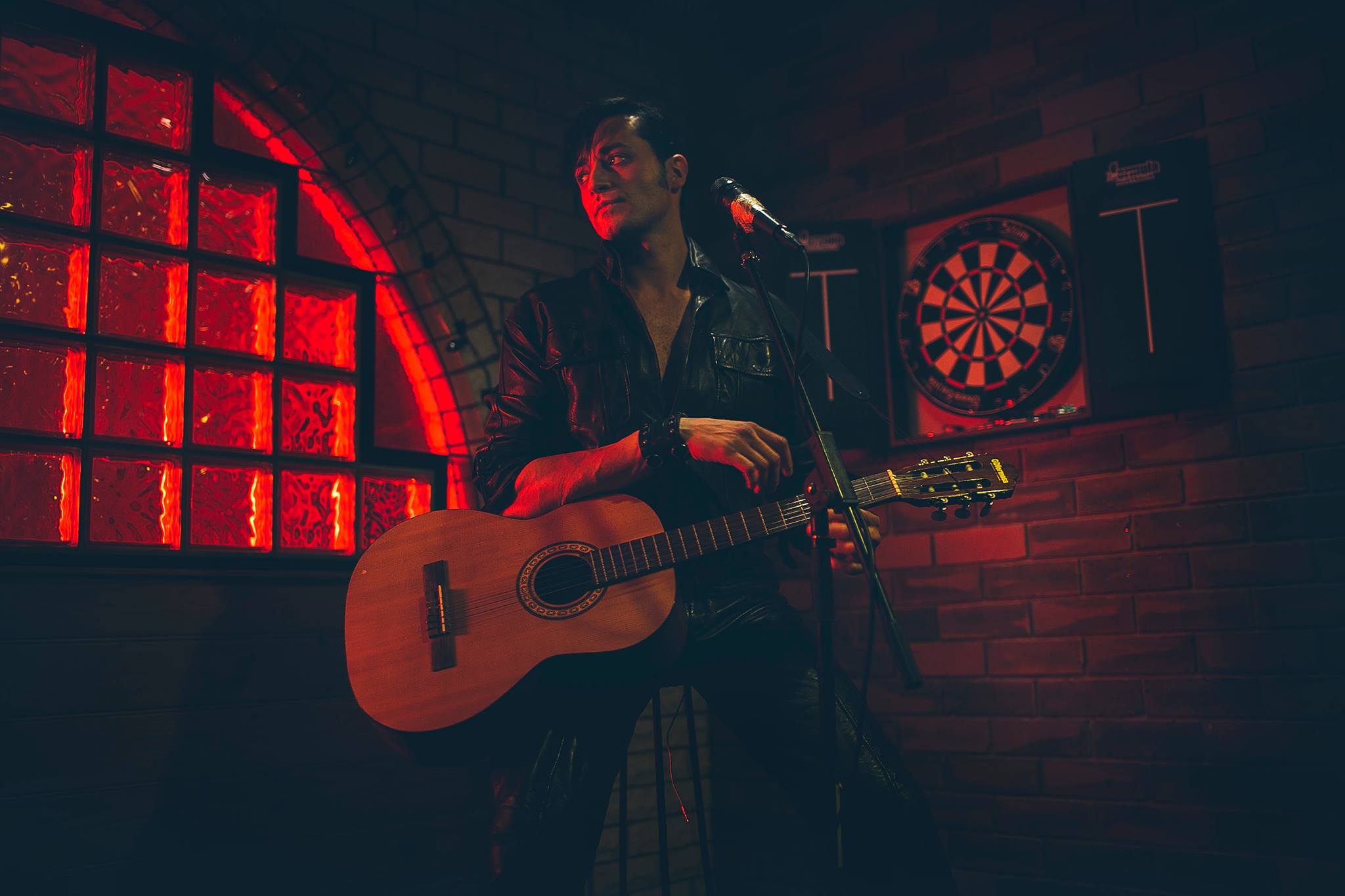 The King is Dead — Mark Diaco performing under red neon